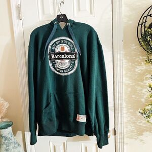 Vtg Barcelona Designs Green Heineken Style Patch Label Hoodie.